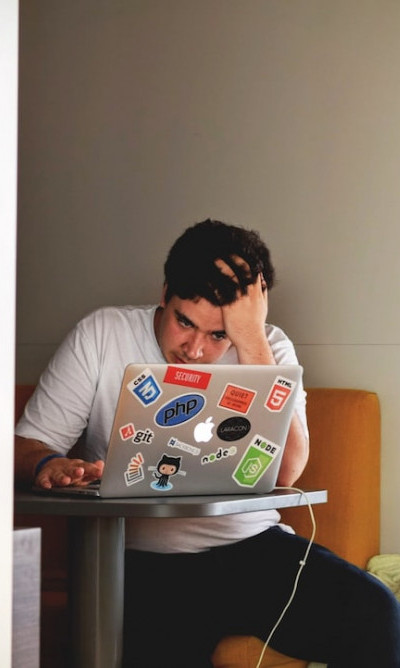 A man studying from his laptop.